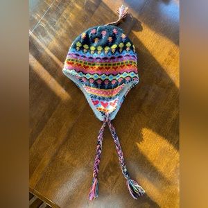 Winter hat with ear flaps & ties.